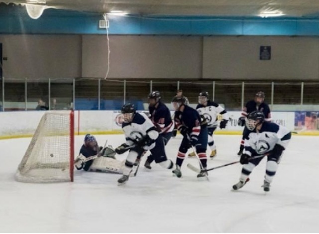 The AAHS hockey team in action.